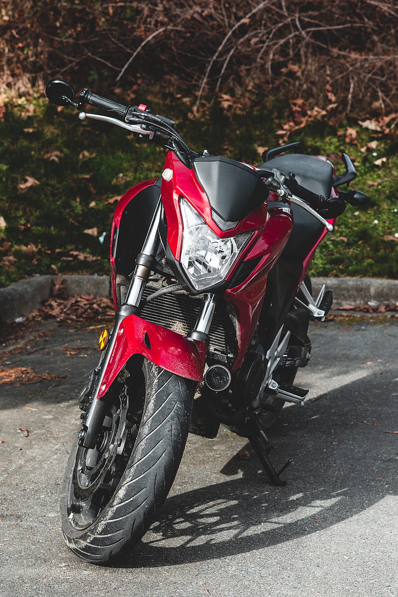 red and black sports bike parked on gray concrete road during daytime, HD phone wallpaper
