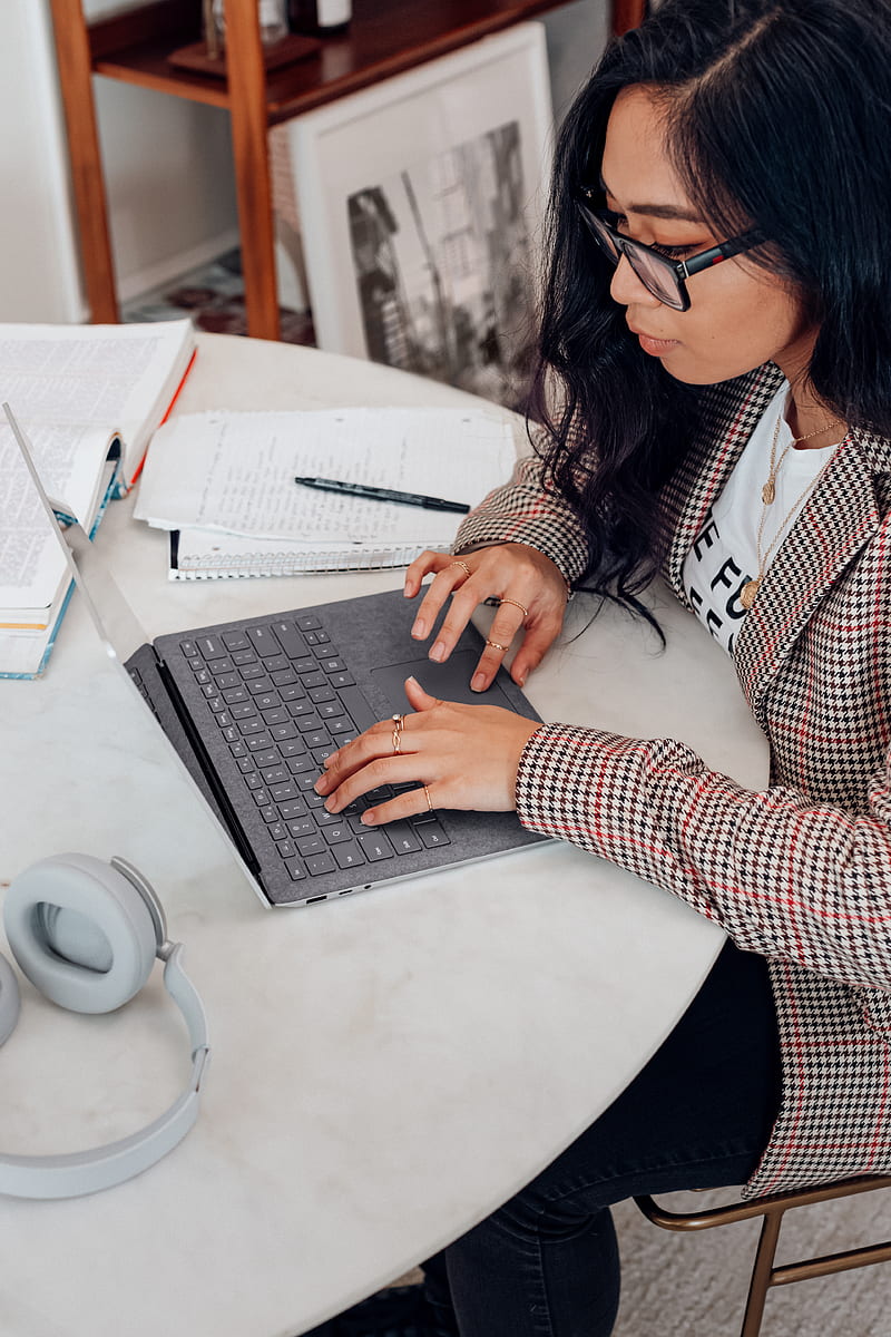 woman in red and white plaid long sleeve shirt using platinum coloured microsoft surface laptop computer, HD phone wallpaper