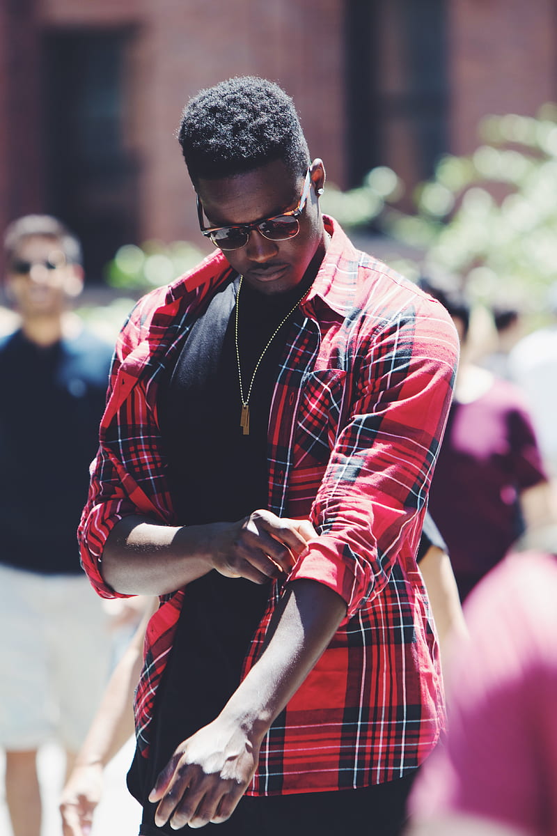 man fixing his red, black, and white plaid sport shirt sleeve during daytime, HD phone wallpaper