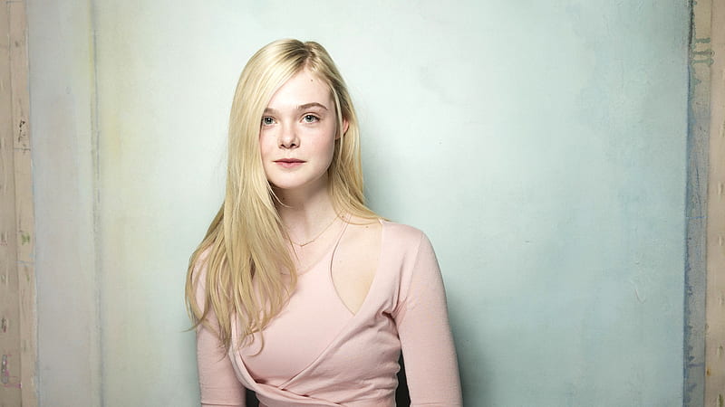 Mary Elle Fanning Is Sitting With Background Of Blue Painted Wall Mary Elle Fanning, HD wallpaper