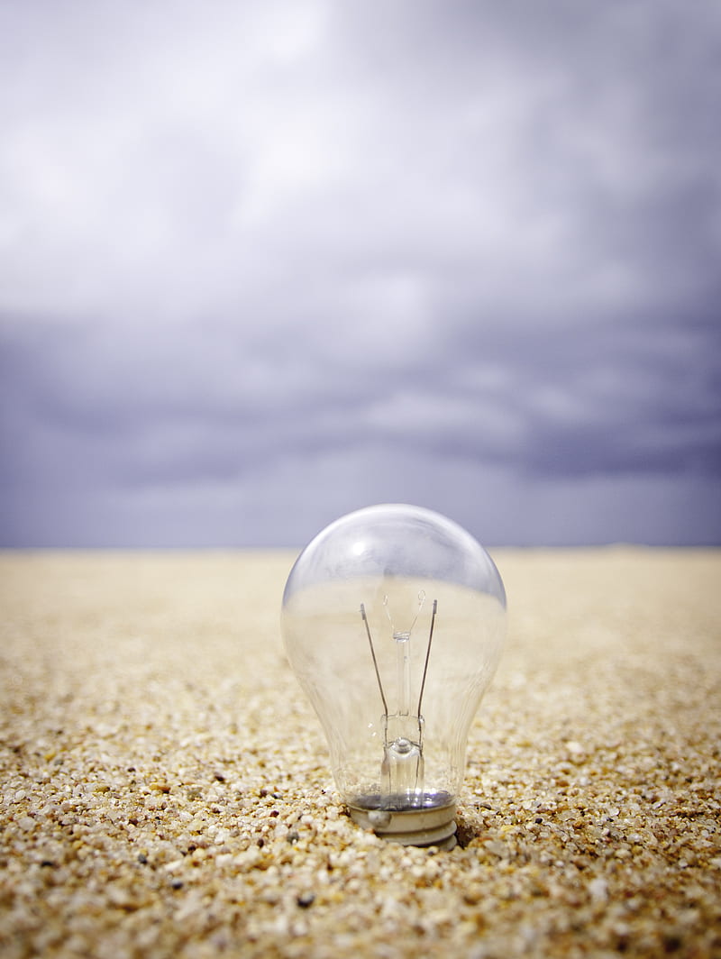 clear glass light bulb on sand during daytime, HD phone wallpaper