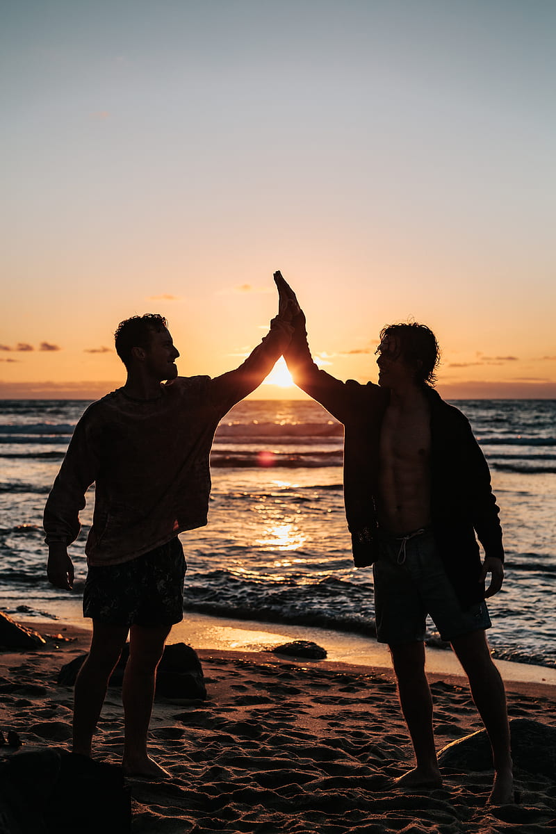 two men clapping each other on shore, HD phone wallpaper