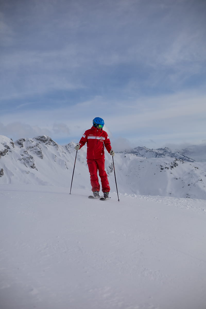 person in red jacket and black pants riding ski blades on snow covered mountain during daytime, HD phone wallpaper