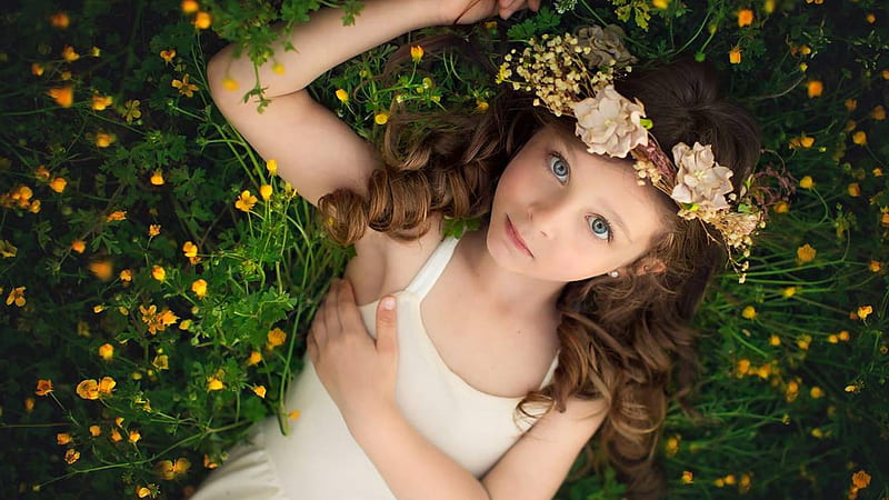 Cute Little Girl Is Lying On Yellow Flower Plant Looking Up Wearing Wreath And White Dress Cute, HD wallpaper