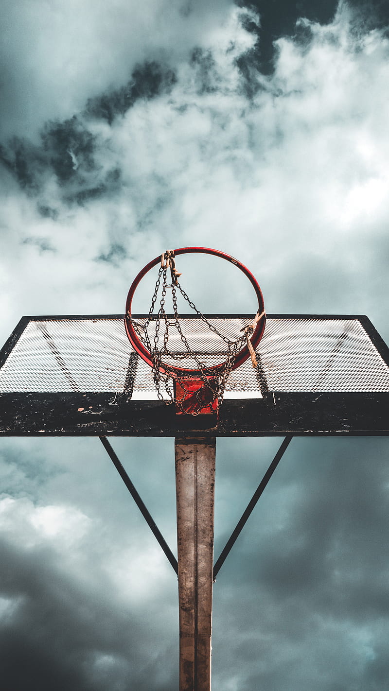 Free Photo  Silhouette shot of setting sun in a basketball hoop  perfect  for wallpaper