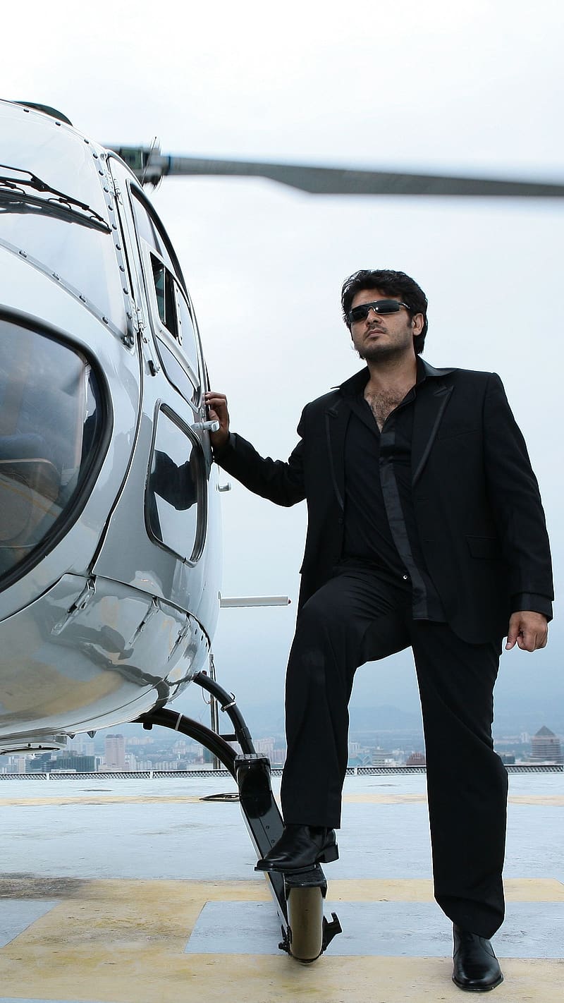 Ajith Kumar Besides Helicopter, ajith kumar, besides helicopter, black, suit, actor, south indian, thala, HD phone wallpaper