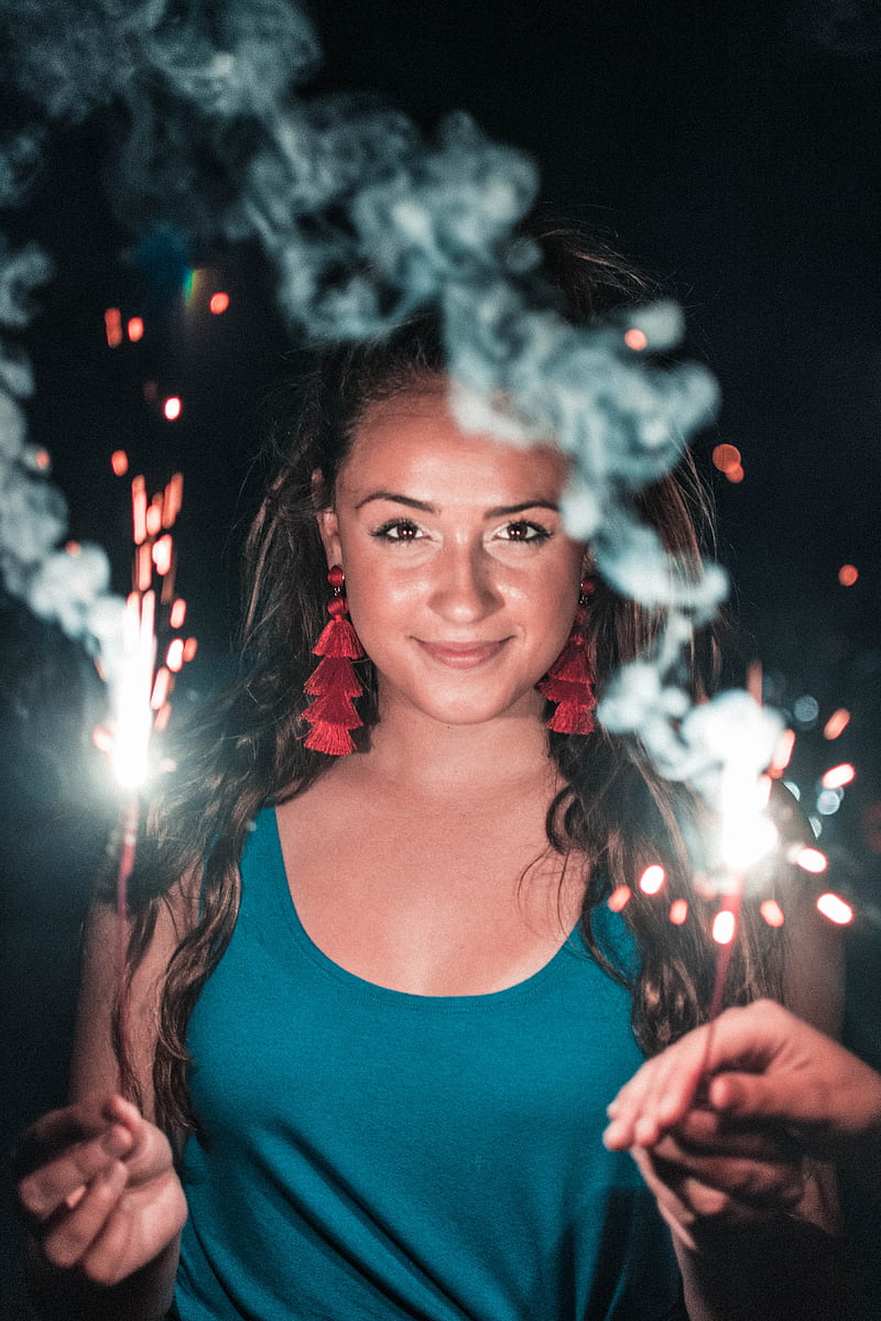 woman holding lighted sparkler taken during night time, HD phone wallpaper