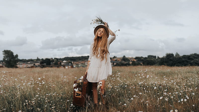 Traveling Cowgirl, luggage, dress, cowgirl, houses, homes, trees, clouds, suitcase, hat, daisies, brunette, flowers, field, HD wallpaper