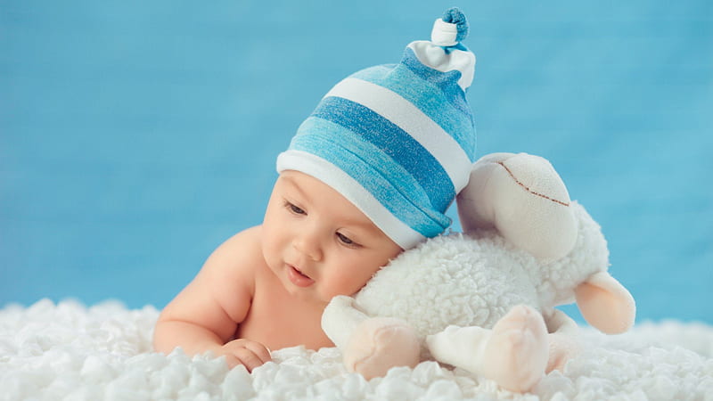 Beautiful Cute Baby Is Lying Down On White Cloth Wearing Blue And White Cap With Bunny Aside In Blue Background Cute, HD wallpaper