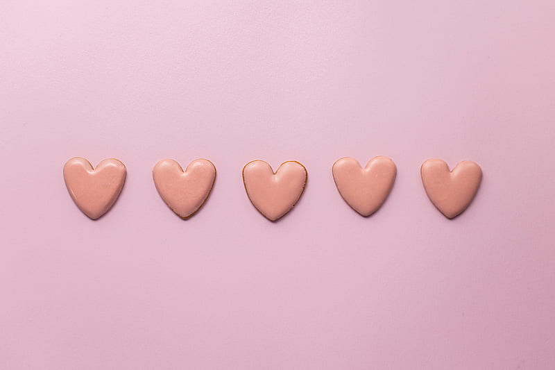 Top view of various handmade small cookies in heart shape placed on pink background next to each other, HD wallpaper