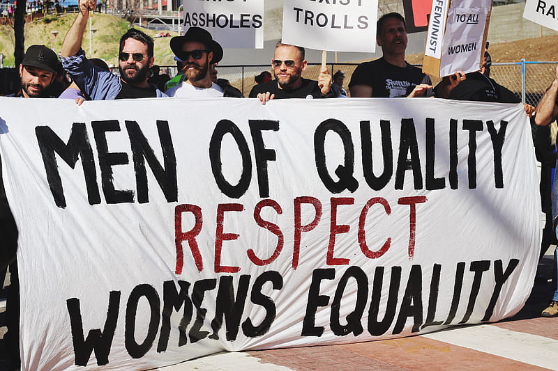 men holding white, black, and red Men of quality respect womens equality banner on road, HD wallpaper