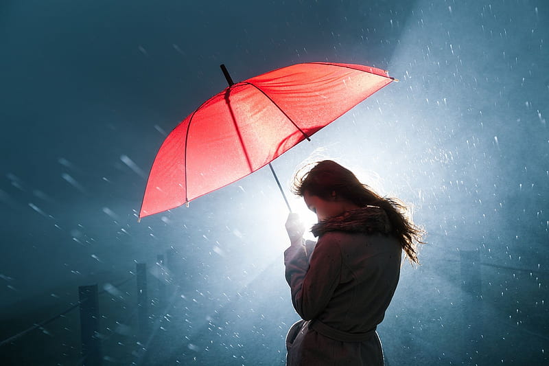 Woman holding a red umbrella during a rainy night by a light, road, woman, night, red, wet, umbrella, coat, water, girl, car, rain, white, blue, light, HD wallpaper