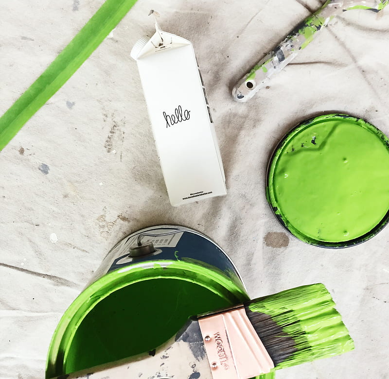 A green paint can and brush next to a carton of Boxed Water, HD wallpaper