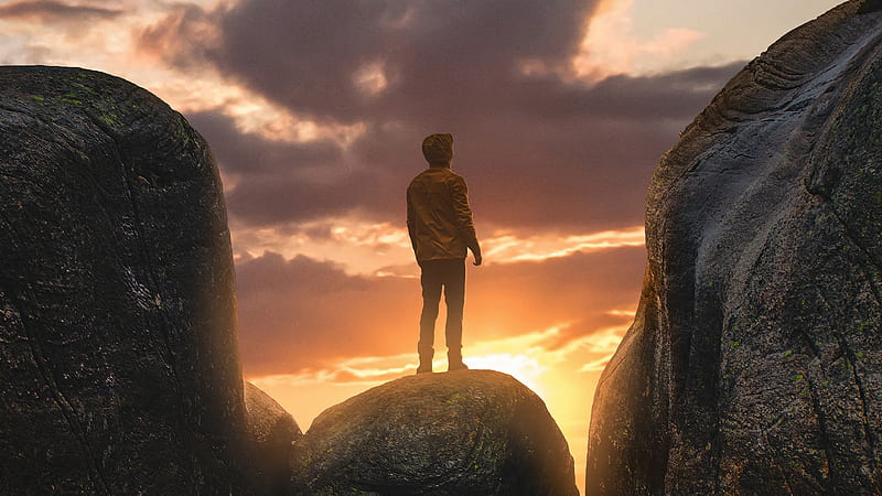 Boy Standing On A Boulder In Between Mountains, hoodie, alone, graphy, mountains, HD wallpaper