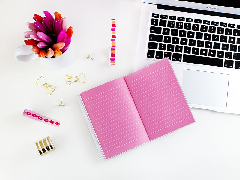 pink lined notebook beside MacBook Air, HD wallpaper