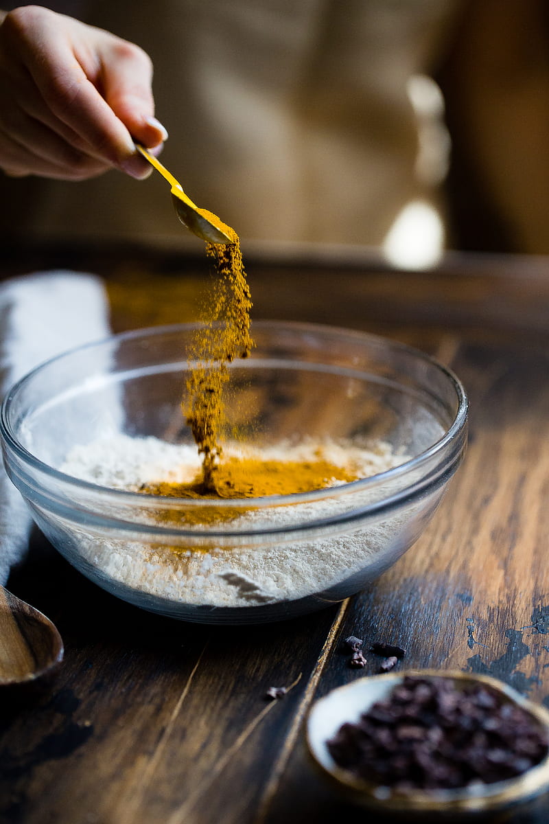 person pouring seasonings on clear glass bowl, HD phone wallpaper