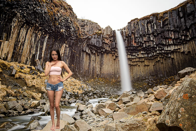 Li Moon at Svartifoss Waterfall in Iceland, asian, shorts, brunette, model, iceland, waterfall, HD wallpaper