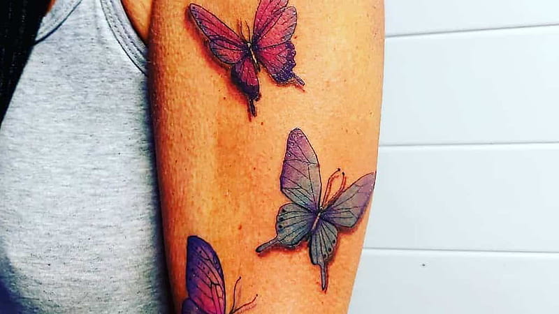 Colored Butterfly Tattoo On Left Back Shoulder