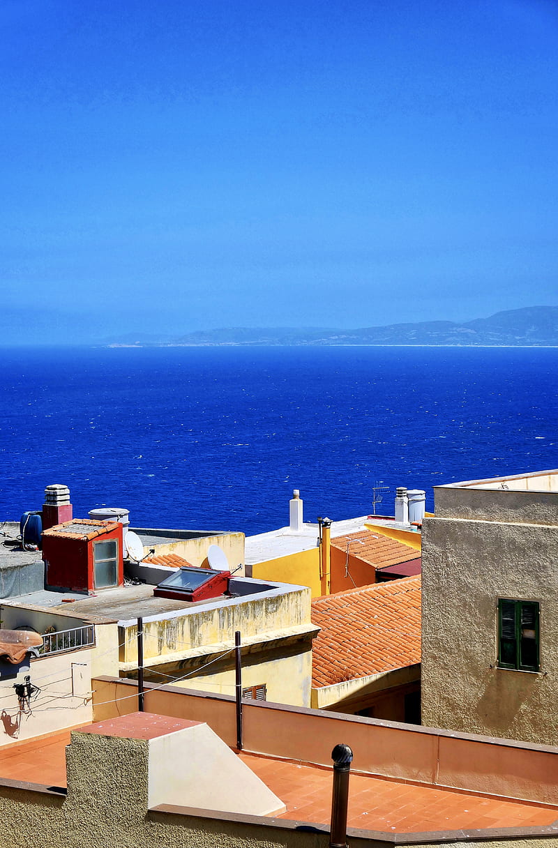 brown-concrete-houses-near-sea-during-daytime-hd-phone-wallpaper-peakpx