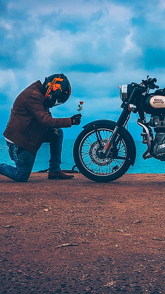 Handsome rider man with beard and mustache posing while take off black moto  glasses near classic style biker cafe racer motorcycle. Bike custom made i  Stock Photo - Alamy
