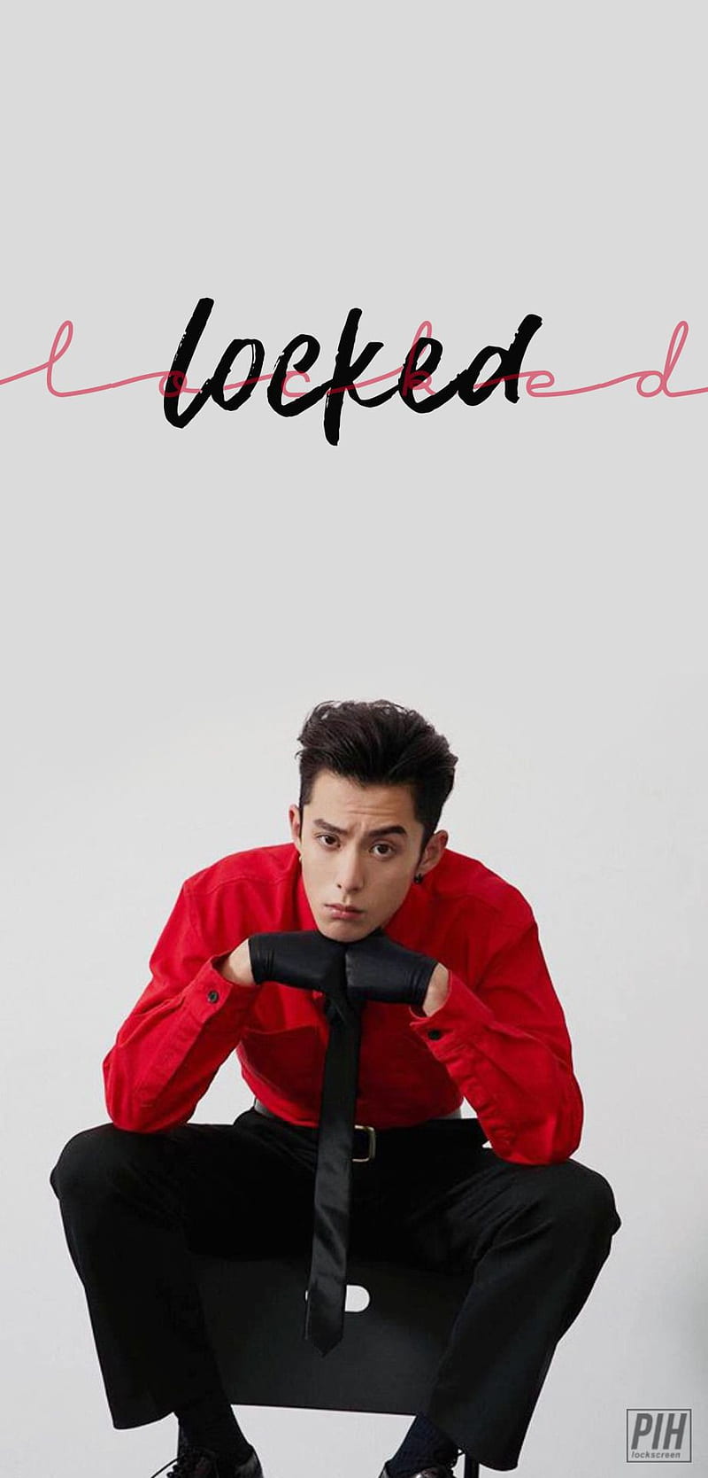 Download Dylan Wang In A Red Couch Wallpaper