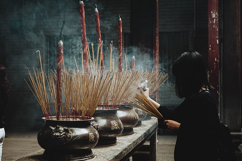 woman putting incense sticks on pot, HD wallpaper