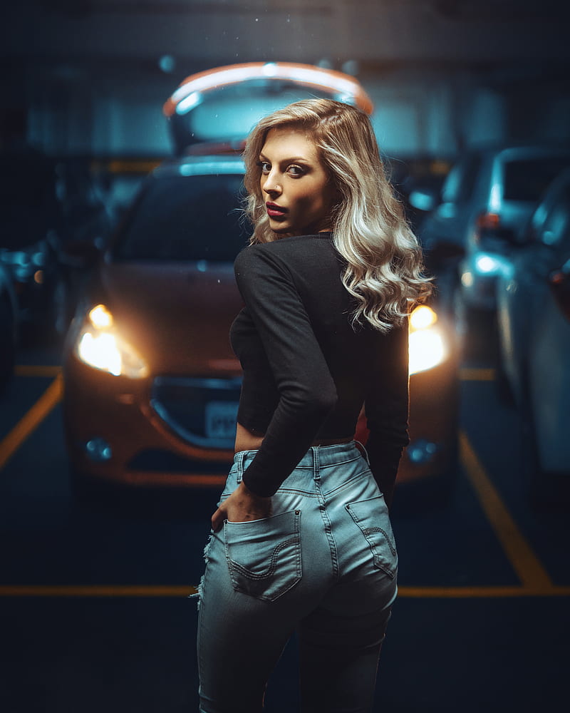 women, model, blonde, portrait display, black tops, jeans, torn jeans, hands in pockets, depth of field, parking, parking lot, car, women with cars, looking at viewer, looking over shoulder, parted lips, HD phone wallpaper
