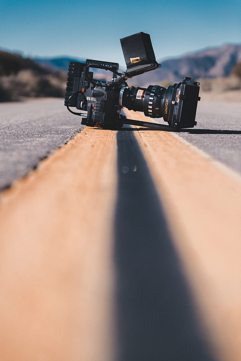 black shoulder-held camcorder on road, HD phone wallpaper