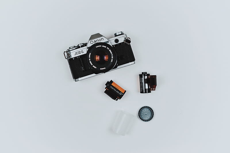 black Canon film camera with two films in flat lay graphy, HD wallpaper
