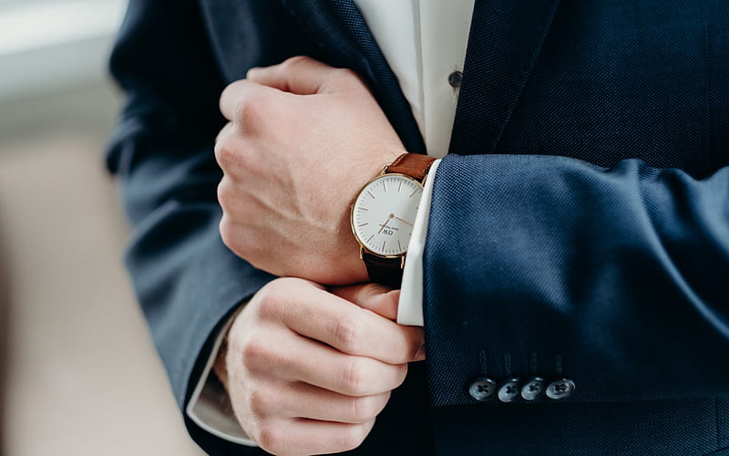 Businessman Holding Watch Stock Photos and Images - 123RF