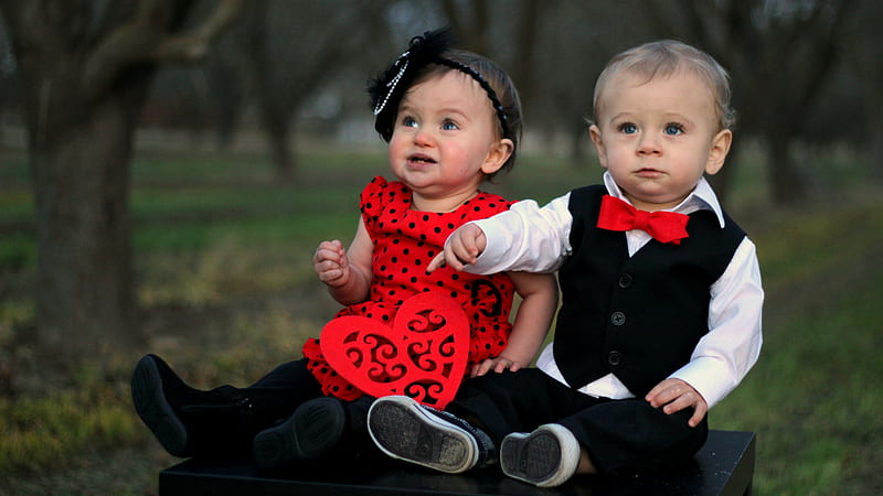 Cute Babies Are Sitting On Black Table Wearing Red Black Dress In Blur Trees Background Cute, HD wallpaper