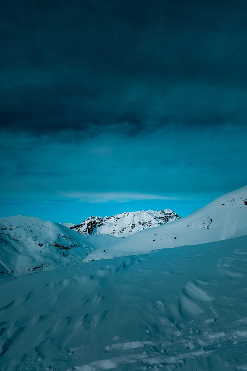 snow-covered-mountain-under-cloudy-sky-during-daytime-hd-phone