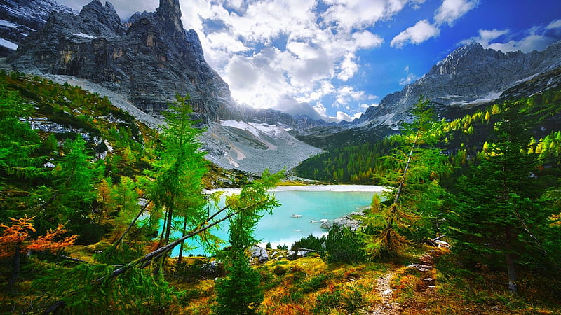 Lake Surrounded By Rock Mountains And Green Trees Plants Bushes Under ...