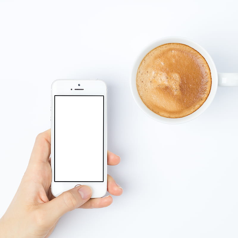 person silver iPhone 5s beside white ceramic mug, HD phone wallpaper