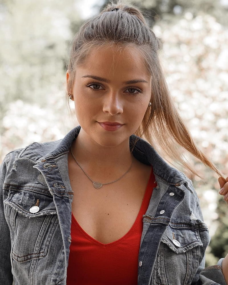 model, women, Jessy Hartel, brunette, jeans jacket, jacket, holding hair, red tops, necklace, young woman, twirling hair, HD phone wallpaper