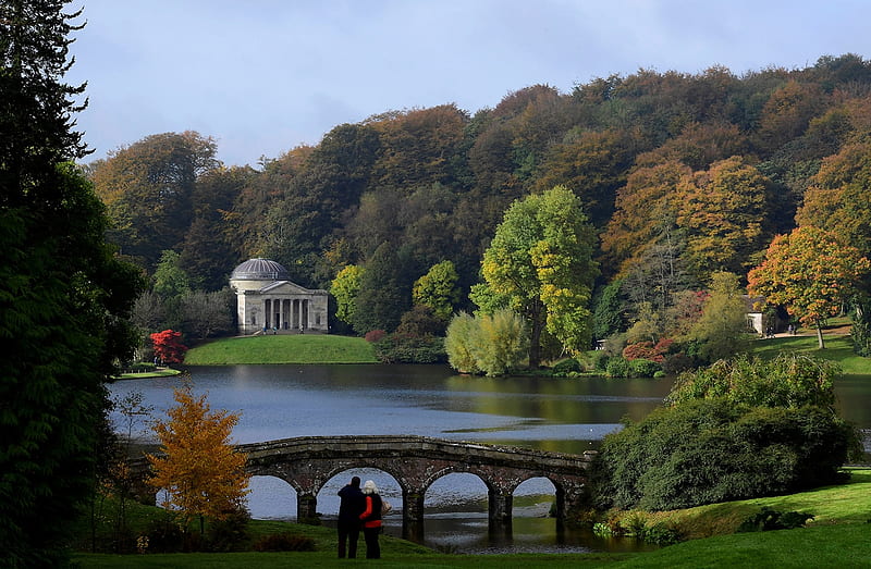 Visitors view the autumn foliage and colours in the gardens and estate at Stourhead in southwest Britain, on October 21, 2016., Couple, Trees, Monument, Green, Grass, Lake, HD wallpaper