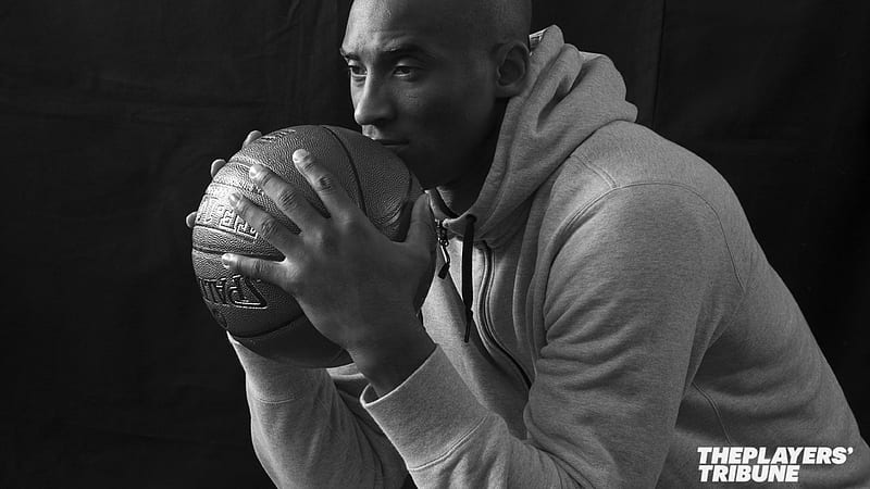 Kobe Bean Bryant Is Holding A Ball Near His Face In A Black Background Celebrities, HD wallpaper