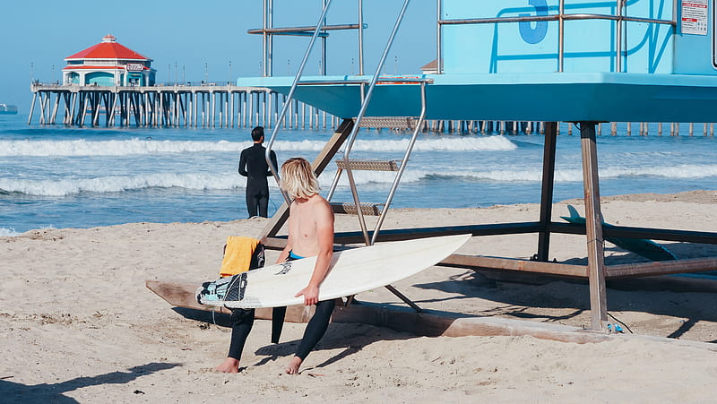 Woman in Black Bikini Sitting on White and Blue Surfboard on Beach, HD wallpaper