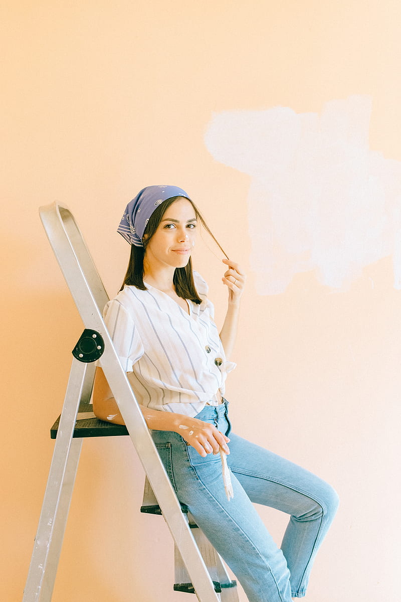 Woman in White Long Sleeve Shirt and Blue Denim Jeans Sitting on Brown Wooden Chair, HD phone wallpaper