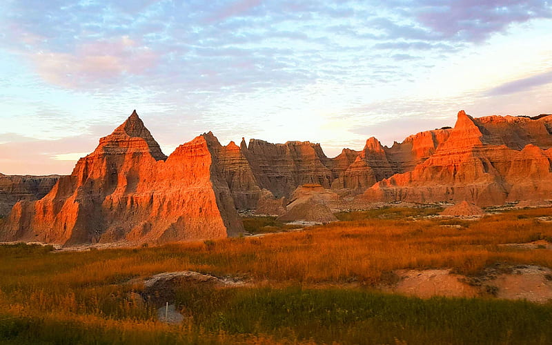 Scattered clouds and sunset glow at Badlands National Park, South Dakota, sky, usa, landscape, mountains, peaks, HD wallpaper
