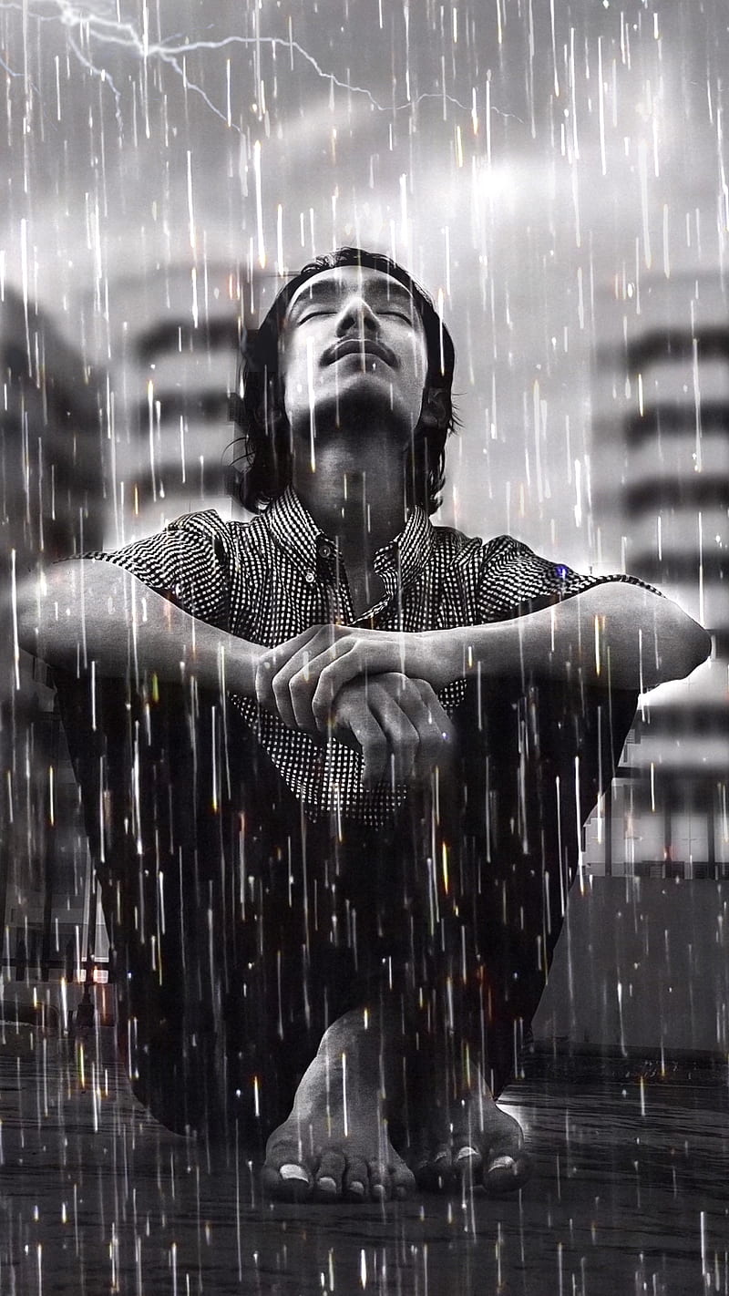 man alone crying in rain