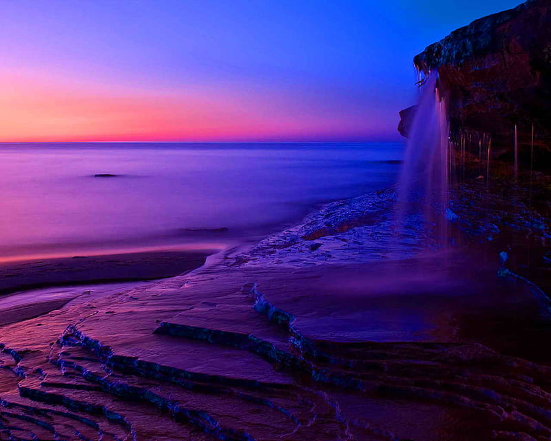 Sea shore at dawn, fall, rocks, sun, sunset, sea, sundown, calm, waterfall, sunrise, dawn, colors, waves, falling water, sky, sea shore, water, purple, peaceful, HD wallpaper