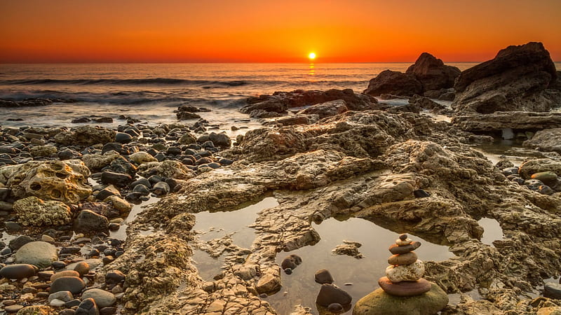 stone pile on a rocky seashore at sunset, rocks, shore, stones, sunset, pile, sea, HD wallpaper